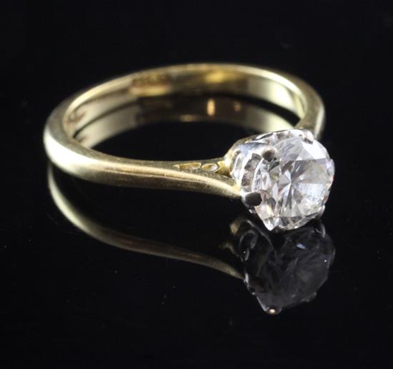 An 18ct gold and claw set solitaire diamond ring, size K.